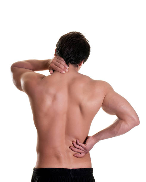 image of a man holding his back due to back pain 