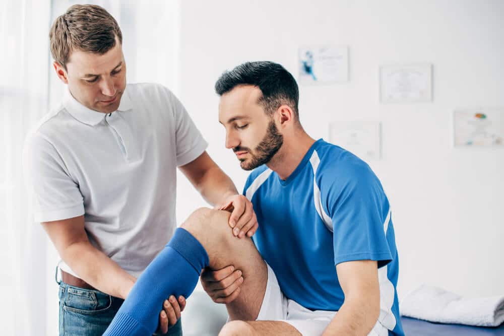 An athlete suffers from sports injury